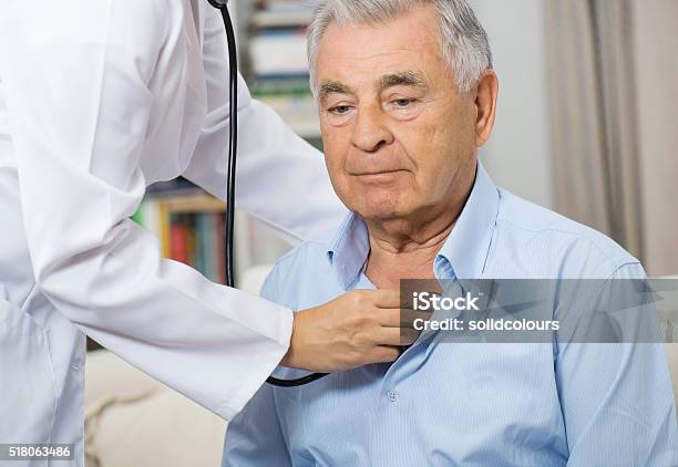 Medical Caring For Senior Man At Home Stock Photo - Download Image Now - Doctor, Patient, Senior Adult