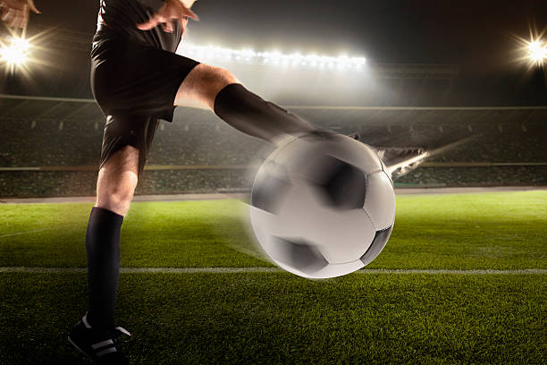 istock Athlete kicking soccer ball 518064828