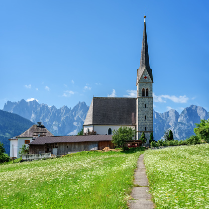 Christianity churh in Gosau village at sunny day. Alps, Austria, Europe.