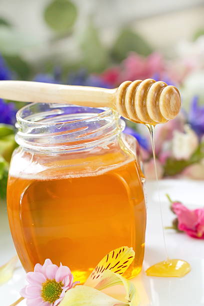 istock Flower honey in glass jar 518065104