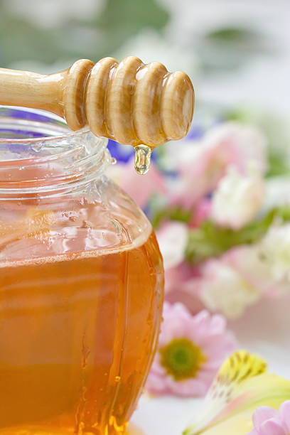 istock Flower honey in glass jar 518065212