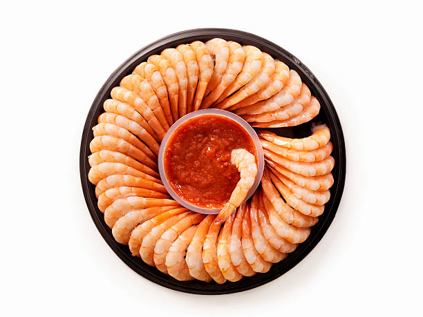 Shrimp Ring with Cocktail Sauce Shrimp Ring with Cocktail Sauce -Photographed on Hasselblad H3D2-39mb Camera shrimp cocktail stock pictures, royalty-free photos & images