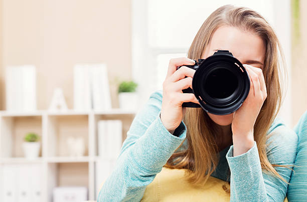 istock Young female photographer with camera 518066948