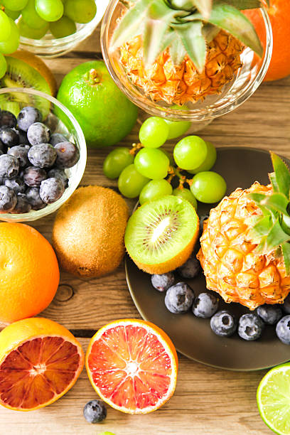 istock tropical fruit, pineapple, kiwi, red orange and blueberries 518084648
