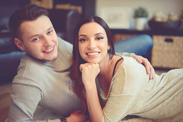 istock Young beautiful couple in home interior 518086862