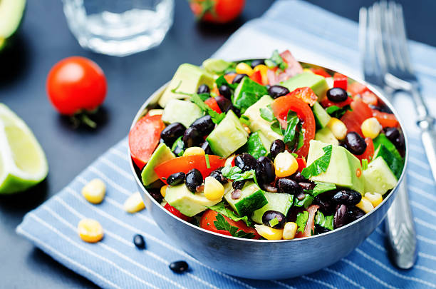 istock Black beans corn avocado cucumber tomato salad with lime dressing 518088252