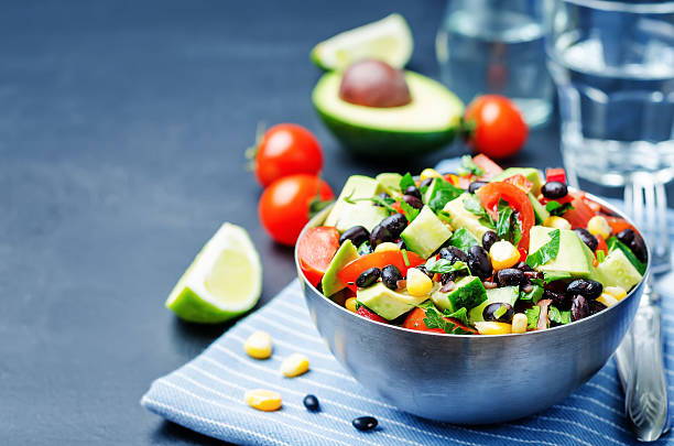 Black beans corn avocado cucumber tomato salad with lime dressing