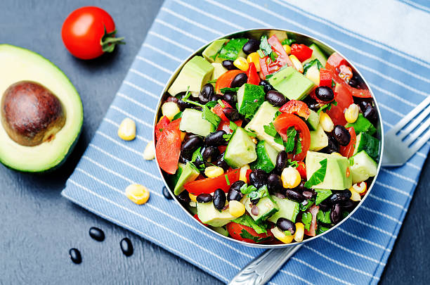 istock Black beans corn avocado cucumber tomato salad with lime dressing 518088276