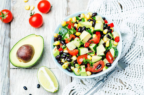 istock Black beans corn avocado cucumber tomato salad with lime dressing 518088294