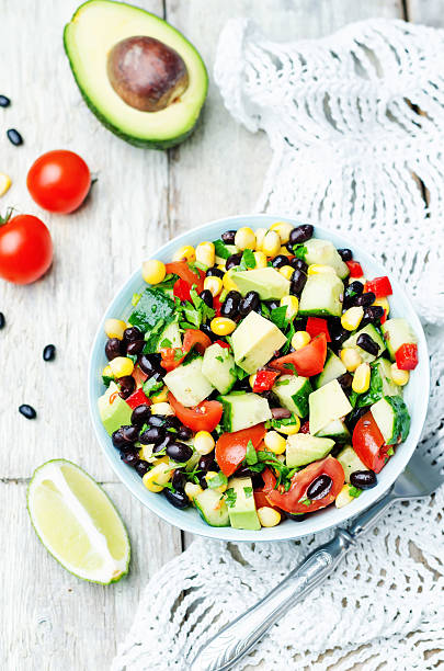 istock Black beans corn avocado cucumber tomato salad with lime dressing 518088298