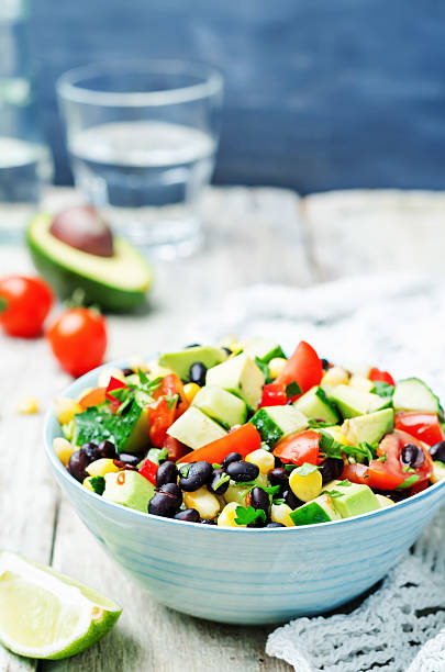 istock Black beans corn avocado cucumber tomato salad with lime dressing 518088302