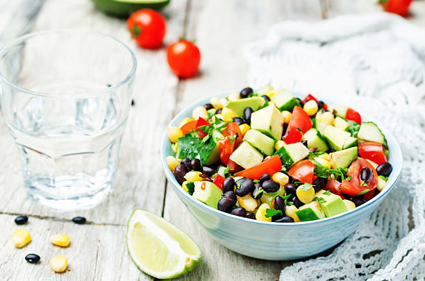 istock Black beans corn avocado cucumber tomato salad 518088312
