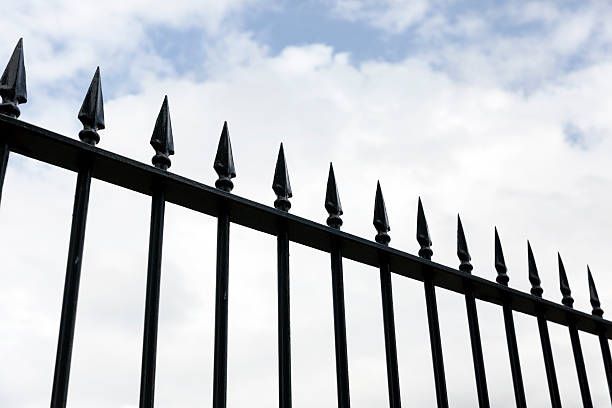 istock Top part of Iron fence against sky, copy space 518088488