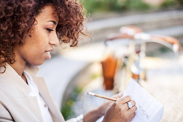 istock Professional woman filling papers during lunch break 518089444