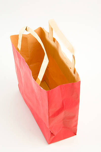 istock paper shopping bag isolated on white 518090360