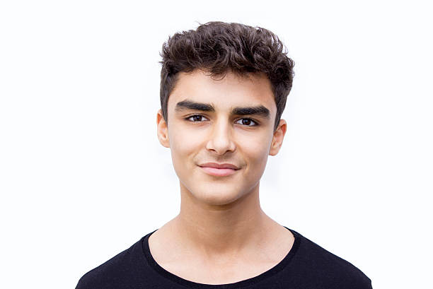 istock Portrait of smiling boy over white background 518090470