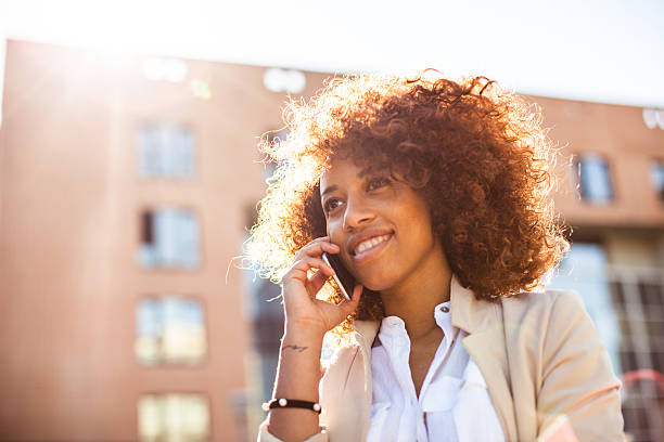 istock Young woman reading a message on the mobile phone 518091946