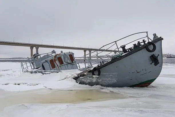 Photo of Sinking vessel in a frozen river