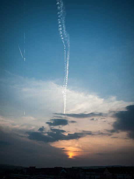 istock Contrail vanishing behind evening clouds 518094389