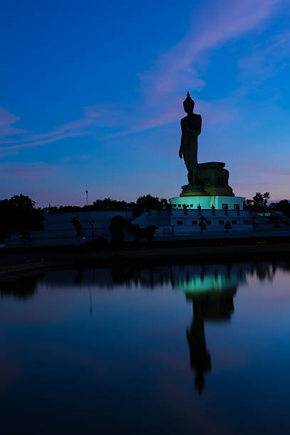 istock Silhouette Buddha with sunset background 518094793