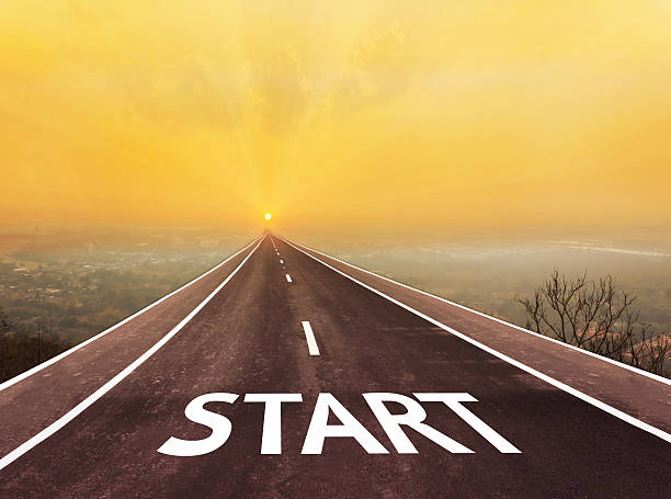 istock Long road with text start above blurred top city view 518094850