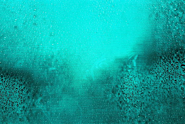 istock Close up of water drops on glass surface as background 518094858