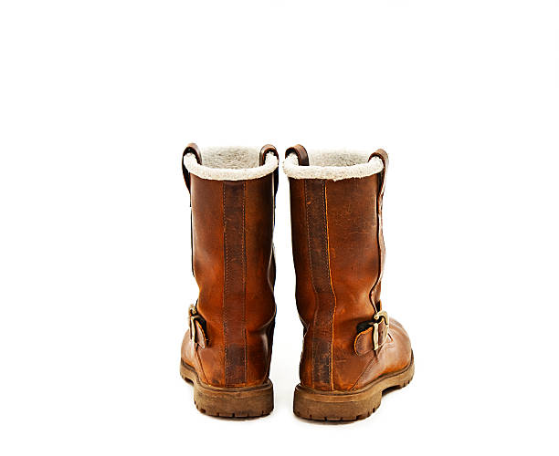 istock Pair of brown winter boots from the back 518095087