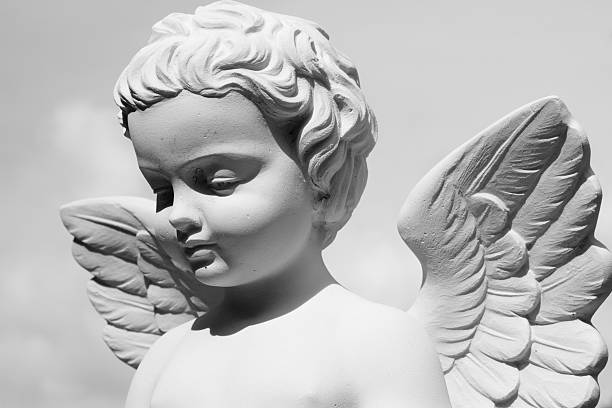 angelic statue detail of sculpture on monumental cemetery in Italy cherub stock pictures, royalty-free photos & images