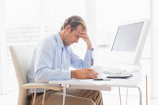 istock Focused businessman working at his desk 518096161