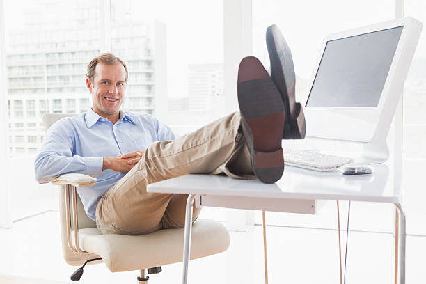 istock Relaxed businessman with his feet up 518096163