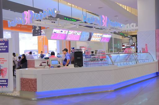 Kuala Lumpur Malaysia - September 13, 2014: People work at Baskin Robbins Ice cream shop at KLIA2 Airport in Kulala Lumpur Malaysia.