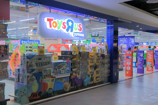 Kuala Lumpur Malaysia - September 27, 2014: People shop at ToysRus shop at KLIA2 airport in Kuala Lumpur Malaysia.