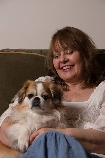 istock Woman Holding Her Dog 518096739