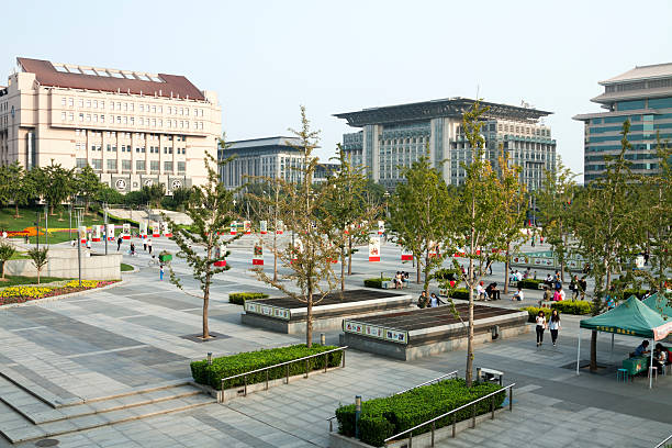 Beijing, Сhina - September 19, 2014: Square in the Xidan district of Beijing, China.  Xidan is one of the main shopping districts of Beijing and a favoured place for locals. This square is a pleasant spot to relax before, or after a day of shopping.