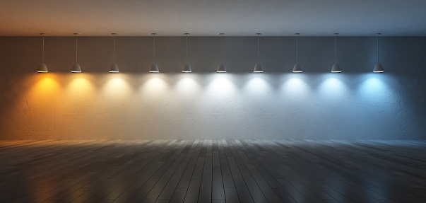 3D renderuing image of 10 hanging lamps which use different bulbs. Color temperature scale. spectrum color on the cracked concrete wall and wooden floor