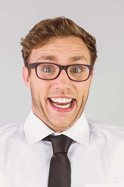 istock Geeky businessman looking at camera 518098217