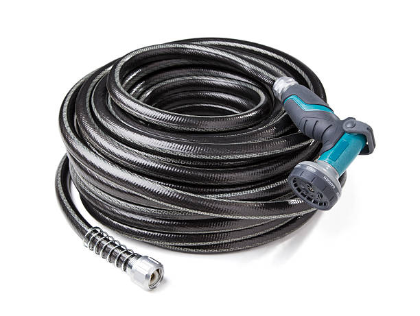 A new garden hose and nozzle on a white background with clipping path.  Please see my portfolio for other gardening images and videos. 