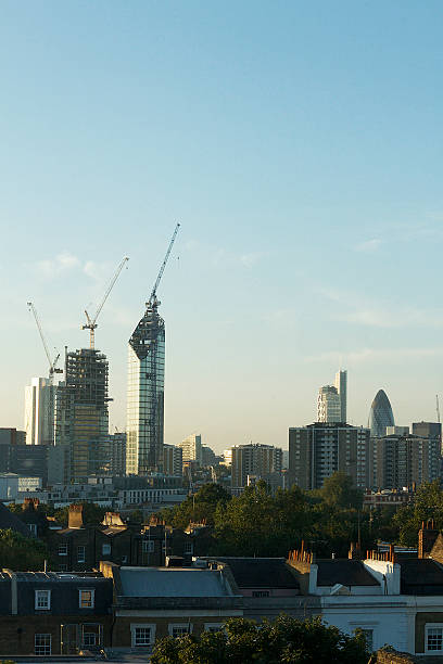 View of New Buildings in Angel, London View from a tall building in the City of London looking across towards new buildings and from Angel Islinton, during sunrise. window chimney london england residential district stock pictures, royalty-free photos & images