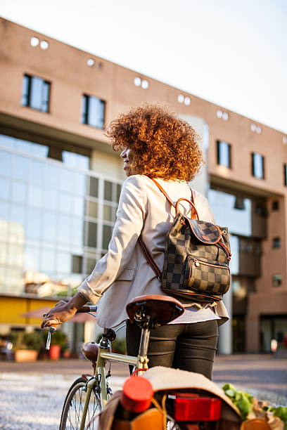 istock Happy woman ready to drive her cycle 518099582