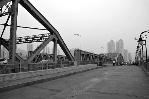 Haizhu Bridge, an iron bridge across the Pearl River in Guangzhou, under polluted sky.