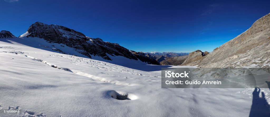 Panoramic view of the Glarnisch glacier, Swiss Alps, Switzerland Panoramic view of the Glarnisch glacier, Swiss Alps, Switzerland. The glacier is part of the Glaernisch-Massiv in the Glarner Alps. The most popular peak of the Glaernisch-Massiv is the Vrenelisgaertli (Verena's Little Garden). The photo is taken in the summertime. Cold Temperature Stock Photo