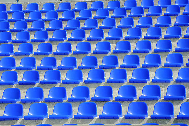 istock plastic blue seats on football stadium 518100123