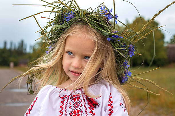 Portrait of ukrainian girl in chaplet Emotional portrait of ukrainian girl in flower chaplet ukrainian culture stock pictures, royalty-free photos & images