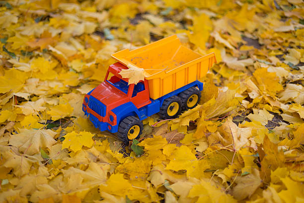 istock Toy car truck outdoors autumn 518101209