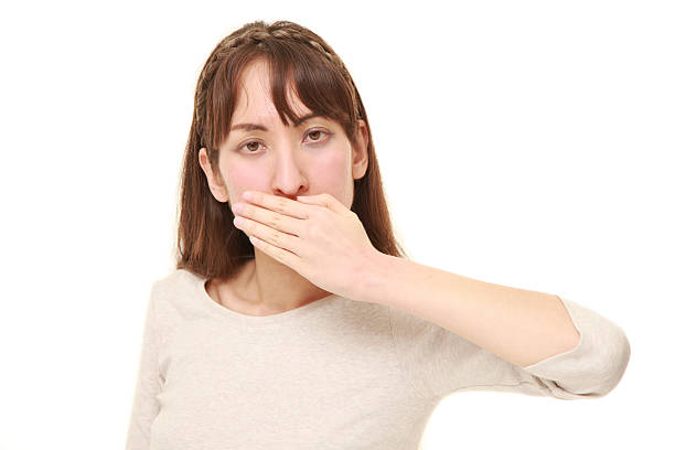 istock woman making the speak no evil gesture 518109400