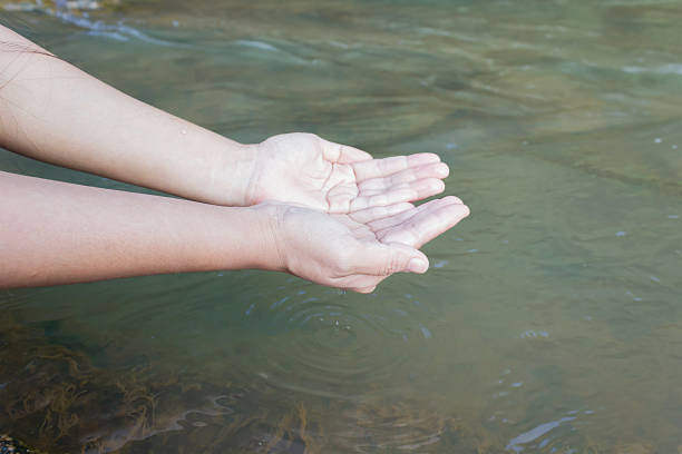 istock Two hand ladle natural pure water in the river 518110074