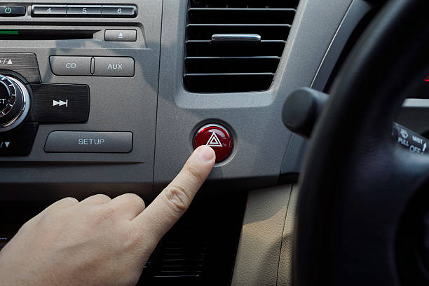 istock Man pressing emergency button in the car. 518110774