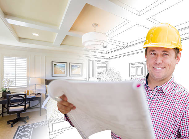 istock Contractor in Hard Hat Over Custom Bedroom Drawing and Photo 518111374