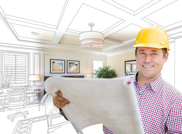 istock Contractor in Hard Hat Over Custom Bedroom Drawing and Photo 518111386