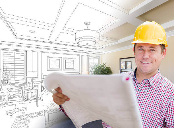 istock Contractor in Hard Hat Over Custom Bedroom Drawing and Photo 518111532